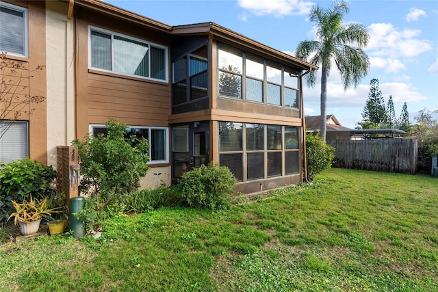 back of house featuring a yard