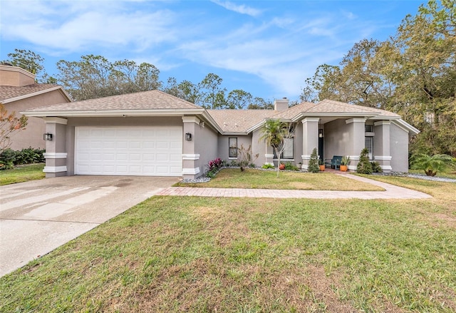 view of front of property with a front yard and a garage