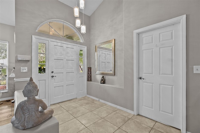 foyer entrance with light tile patterned floors