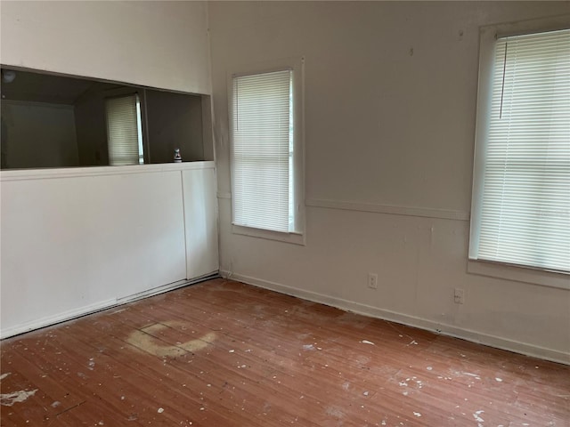 spare room with hardwood / wood-style floors