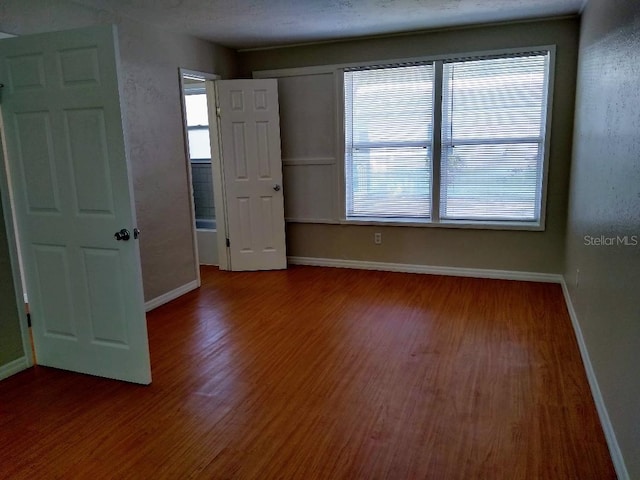 spare room featuring hardwood / wood-style flooring