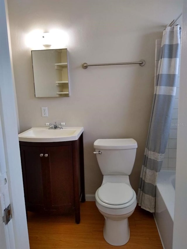 full bathroom with shower / bath combination with curtain, wood-type flooring, toilet, and vanity