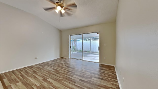 spare room with ceiling fan, light hardwood / wood-style floors, and lofted ceiling