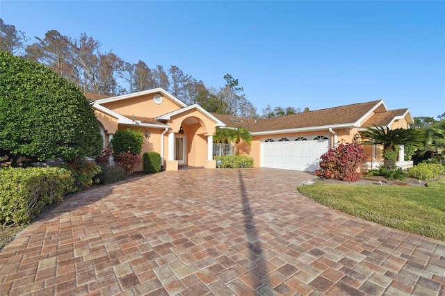 single story home featuring a garage