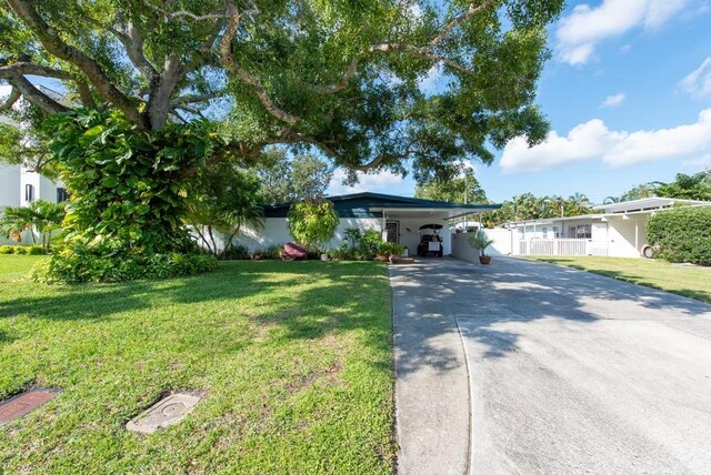 604 Danube Ave, Tampa, FL 33606 - single story home featuring a front lawn and a carport