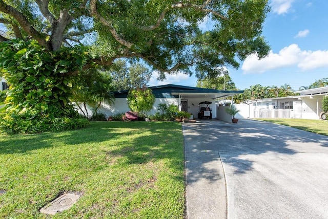 604 Danube Ave, Tampa, FL 33606 - ranch-style home with a front lawn and a carport