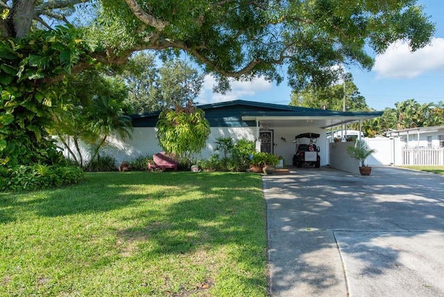 604 Danube Ave, Tampa, FL 33606 - view of front of house with a carport and a front lawn