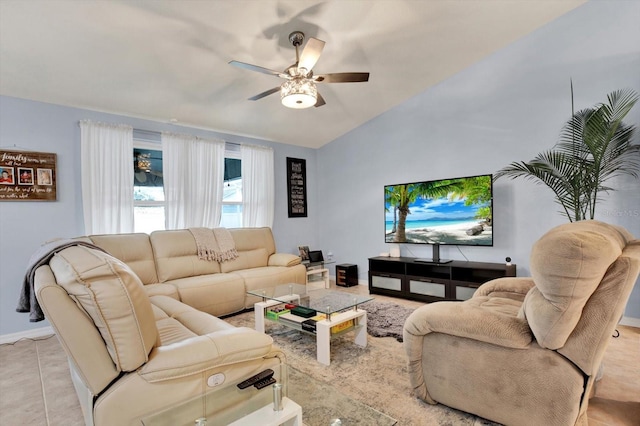 living room featuring ceiling fan, light tile patterned flooring, and vaulted ceiling