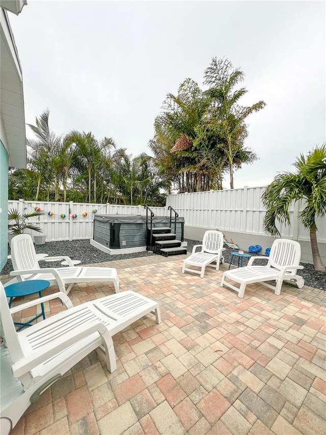 view of patio / terrace featuring a hot tub