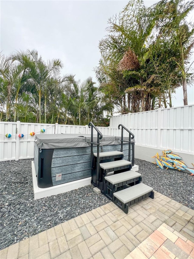 view of patio / terrace featuring a hot tub