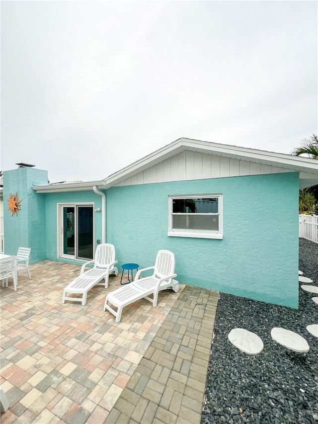 back of house with a patio