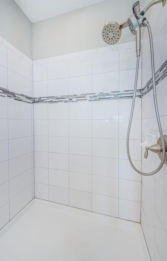 bathroom with a tile shower