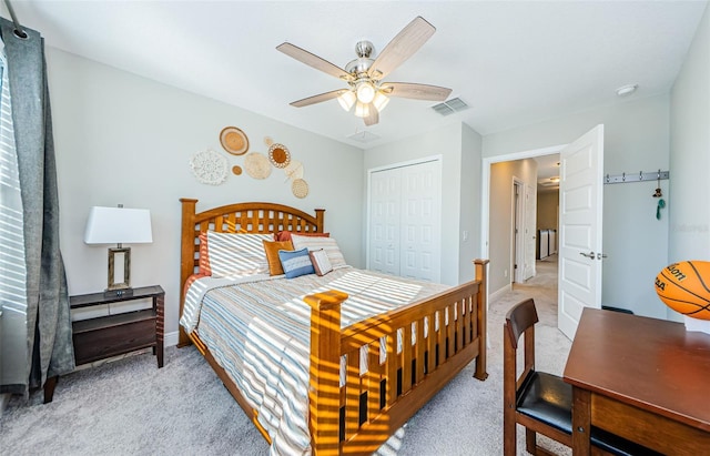 carpeted bedroom with a closet and ceiling fan