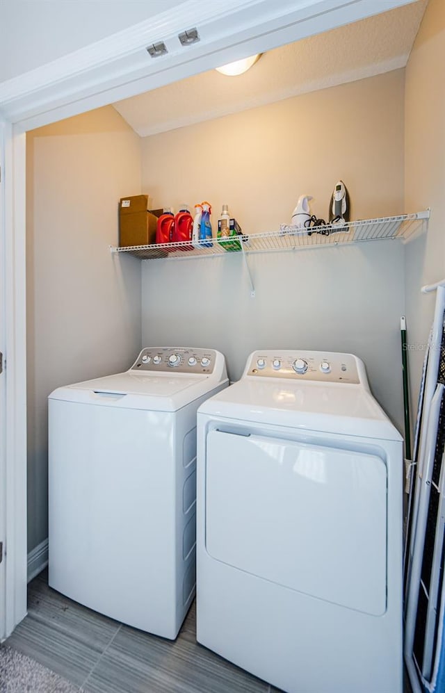 washroom featuring independent washer and dryer