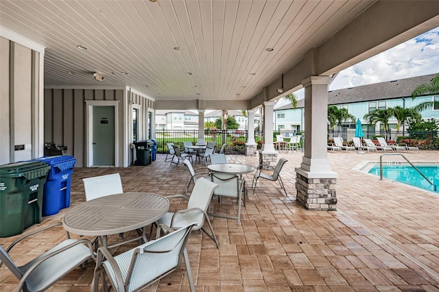 view of patio featuring a community pool