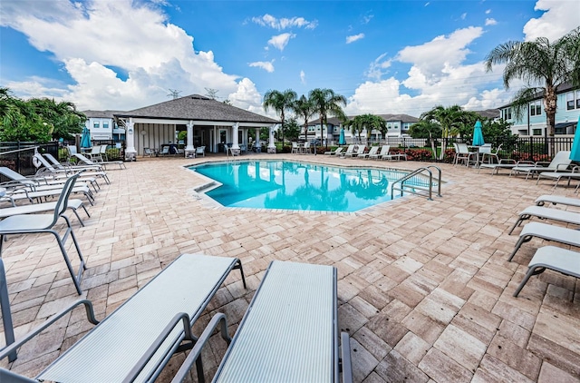 view of swimming pool with a patio