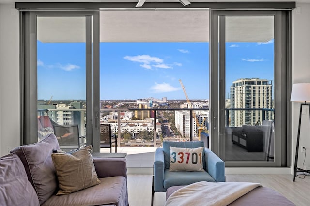 living room with hardwood / wood-style floors and expansive windows