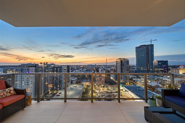 balcony at dusk with an outdoor hangout area