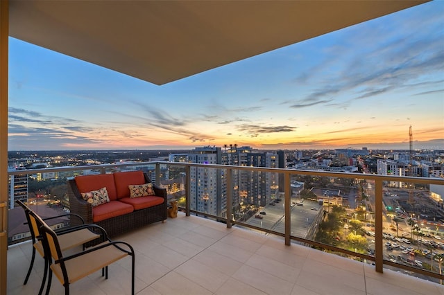 balcony at dusk with outdoor lounge area