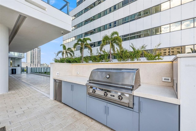 view of patio with a grill and an outdoor kitchen