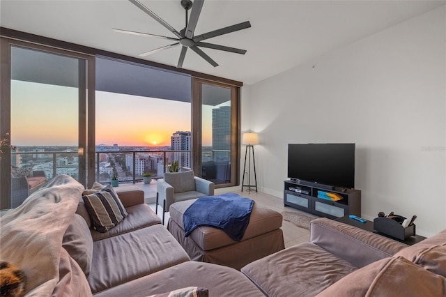 301 1st St S Unit 2006, Saint Petersburg, FL 33701 - living room featuring ceiling fan, expansive windows, carpet floors, and baseboards