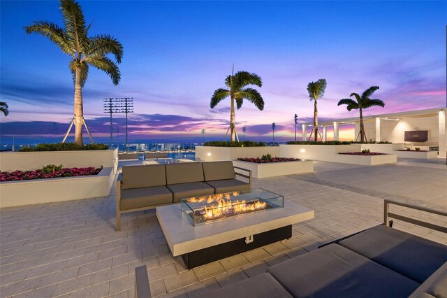 301 1st St S Unit 2006, Saint Petersburg, FL 33701 - patio terrace at dusk with an outdoor living space with a fire pit