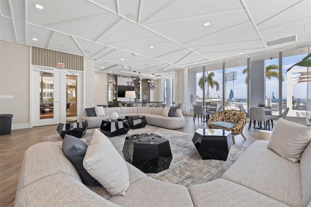 301 1st St S Unit 2006, Saint Petersburg, FL 33701 - living area featuring floor to ceiling windows, wood finished floors, french doors, and baseboards