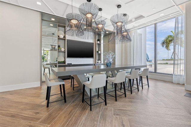 301 1st St S Unit 2006, Saint Petersburg, FL 33701 - dining area with an inviting chandelier and baseboards