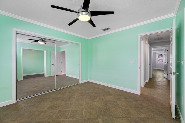 unfurnished bedroom with a closet, ceiling fan, and ornamental molding