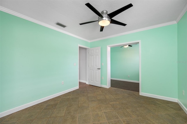 unfurnished room featuring ceiling fan and crown molding