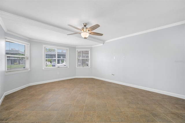 spare room with ornamental molding and ceiling fan