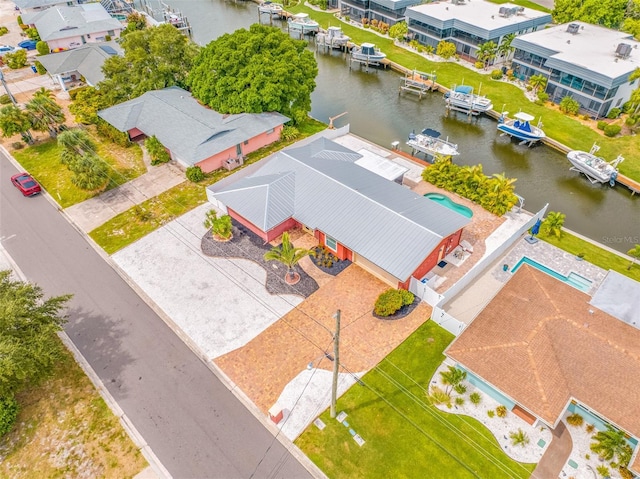 birds eye view of property featuring a water view