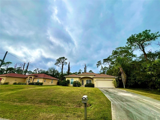 view of front facade featuring a garage and a front lawn