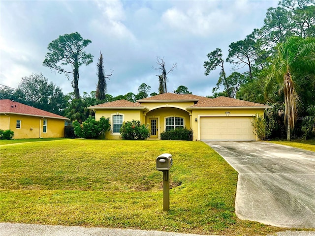 view of front of home featuring a garage and a front lawn