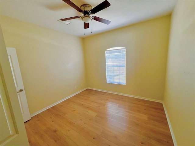 empty room with light hardwood / wood-style flooring and ceiling fan