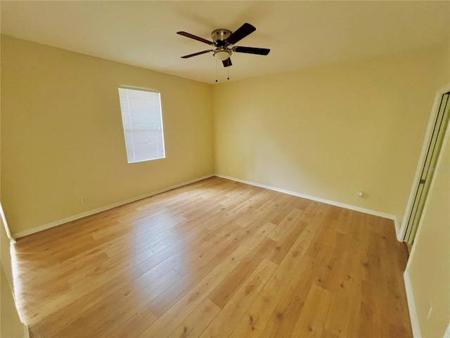 unfurnished room with ceiling fan and light hardwood / wood-style floors