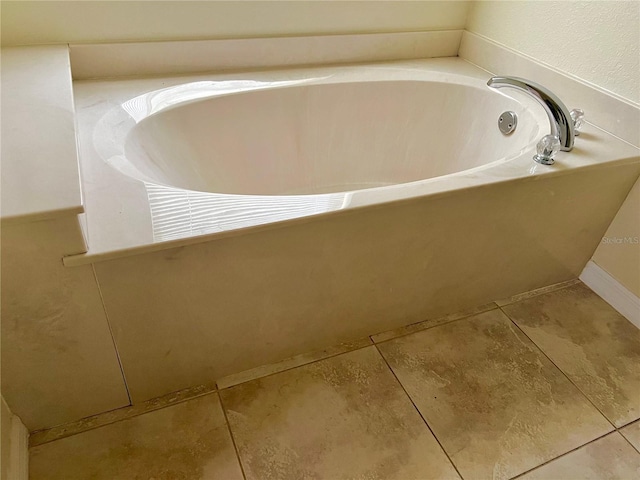 bathroom featuring a tub and tile patterned flooring