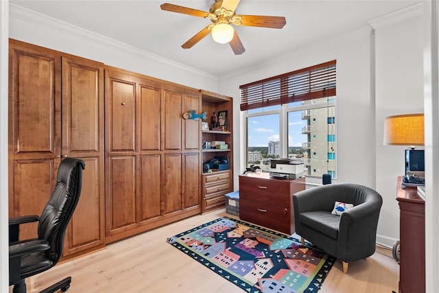 office space with ceiling fan, light hardwood / wood-style floors, and ornamental molding