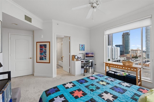 bedroom featuring light carpet, connected bathroom, ceiling fan, and crown molding