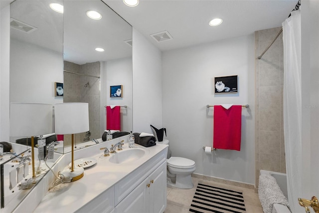 full bathroom featuring tile patterned floors, shower / tub combo with curtain, vanity, and toilet