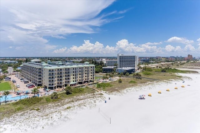 birds eye view of property with a view of the beach and a water view