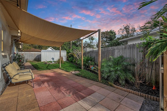 patio terrace at dusk with a storage shed