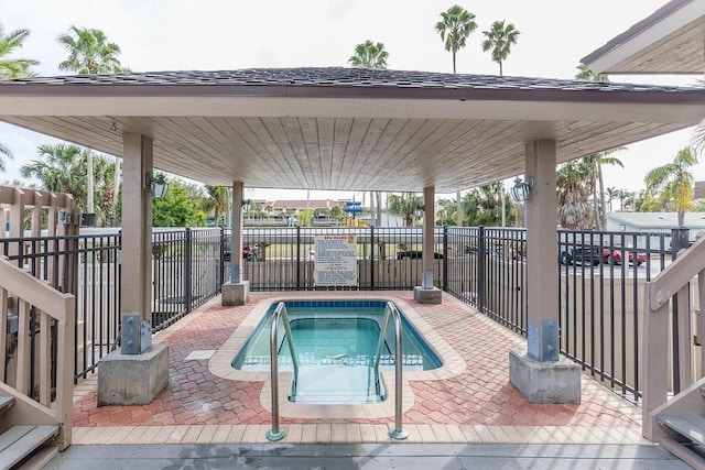 view of pool featuring a hot tub