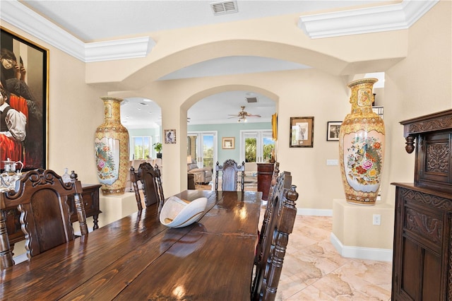 dining room featuring crown molding