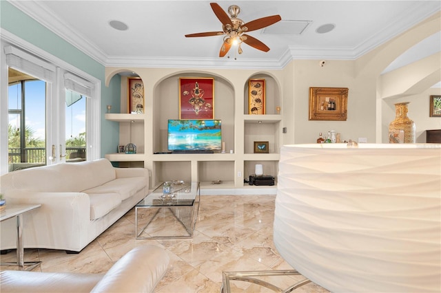 living room with ornamental molding, built in features, and ceiling fan