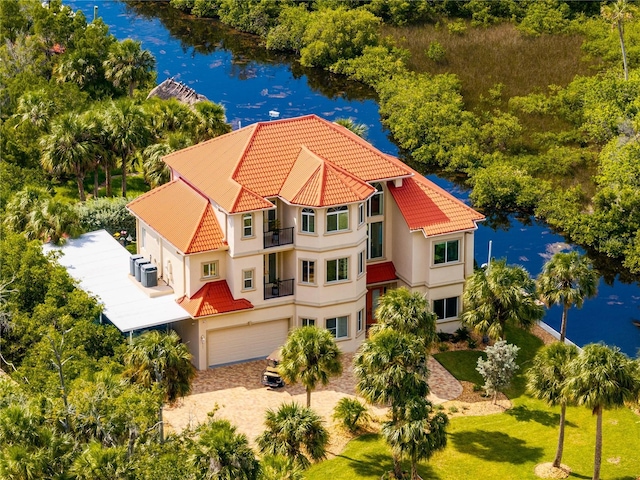 birds eye view of property with a water view