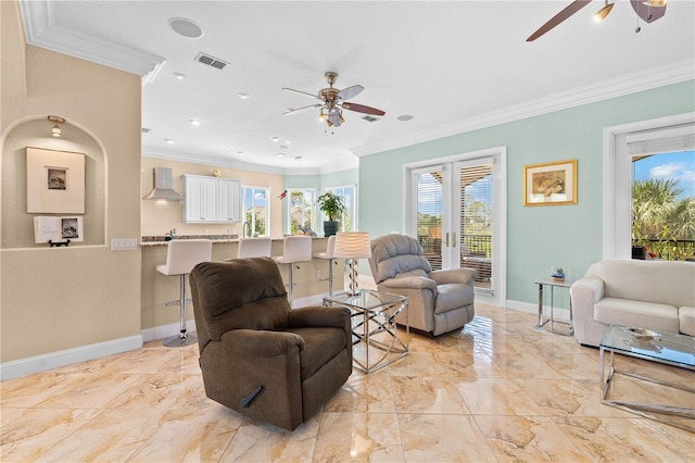 living room featuring baseboards, a ceiling fan, marble finish floor, and ornamental molding