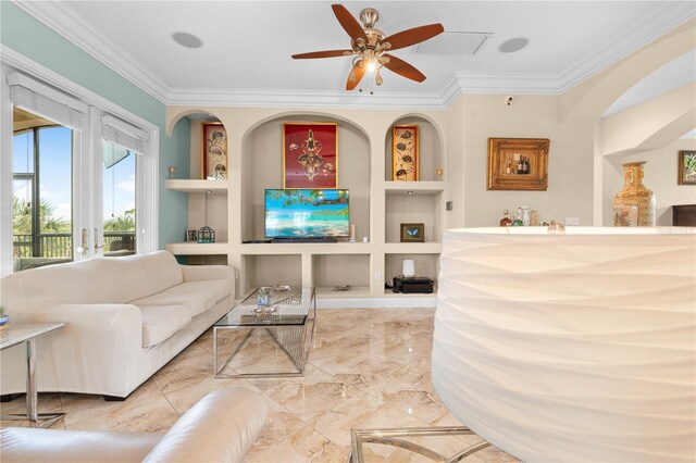 interior space featuring ceiling fan, built in shelves, and ornamental molding