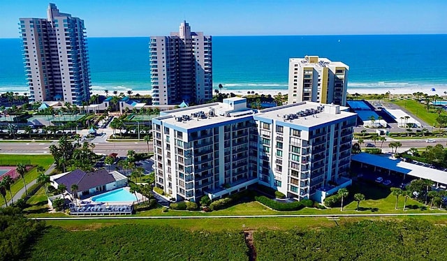 bird's eye view with a water view and a view of the beach