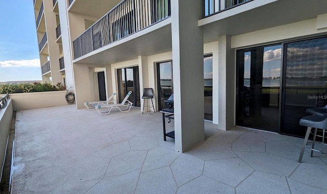 view of patio with a balcony